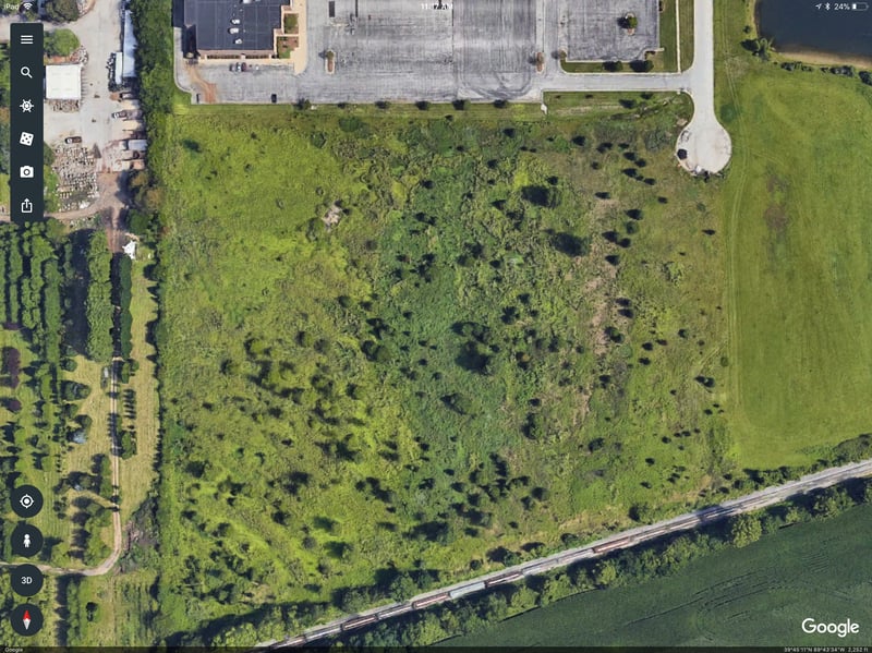 You can see where the AMC movie theater lot encroaches the north side of the original drive in. You can still see the concreate pad of what looks to be the restrooms or concession building. This area is engulfed with weeds and trees now.