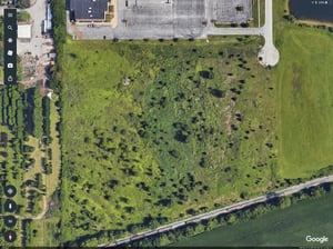 You can see where the AMC movie theater lot encroaches the north side of the original drive in. You can still see the concreate pad of what looks to be the restrooms or concession building. This area is engulfed with weeds and trees now.