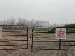 Former site with screen in the background