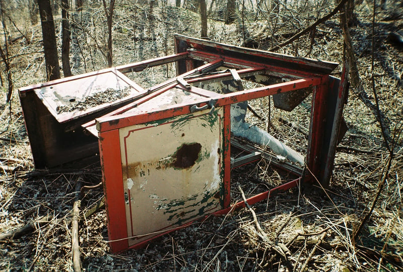 Concession cart lost in the weeds near the screen.