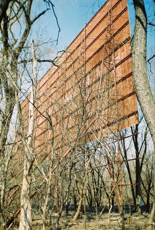 Orange/brown on one side, white on the other.  The screen from behind.