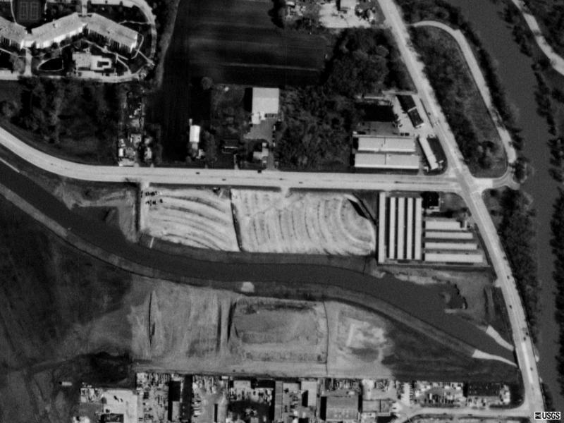 TerraServer image.   What was left of the Twin as of 1998.  A regional airport runway bisects the theatre.  Southern half looks excavated.  Northern half just a gravel ramped field with screen.   Screen is now gone too.