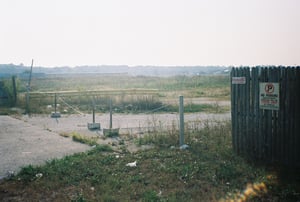 Exit gate with remaining field in the distance.