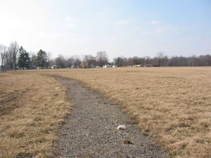 Gravel path between parking rows.