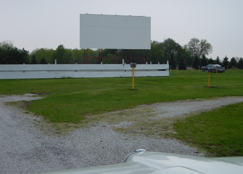 Screen #2 is at the back of the lot. Park next to the yellow poles for screen #2.