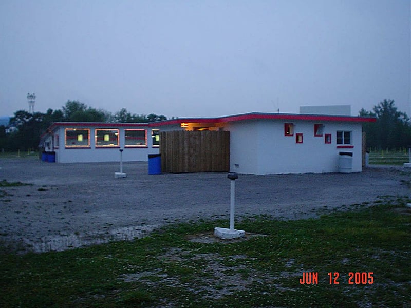 The projection/restroom building is in the foreground. It's a separate building from the concession stand.