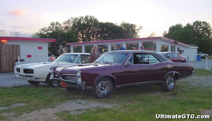 Muscle cars parked near the snack bar.  This is a 1967 GTO and a 1968 GTO.
