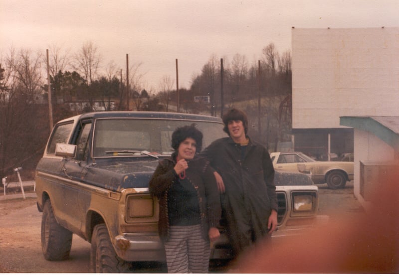This photo is of Elizabeth Horton (owner) And Dale Harth (projectionist). They were doing maintenance work while the drive-in was closed for the winter season. (1979)