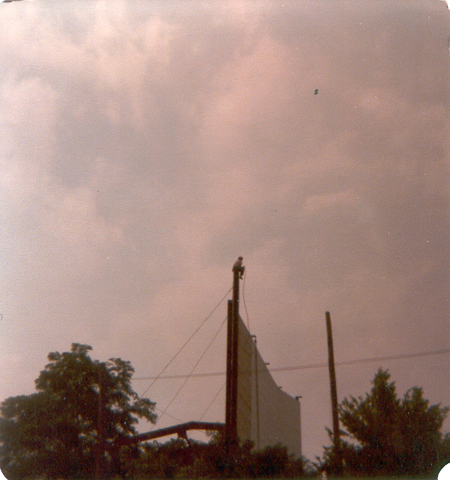 This photo is of Riley Horton II taking in the view while on break painting the huge screen tower. (1982)