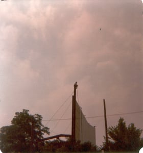 This photo is of Riley Horton II taking in the view while on break painting the huge screen tower. (1982)