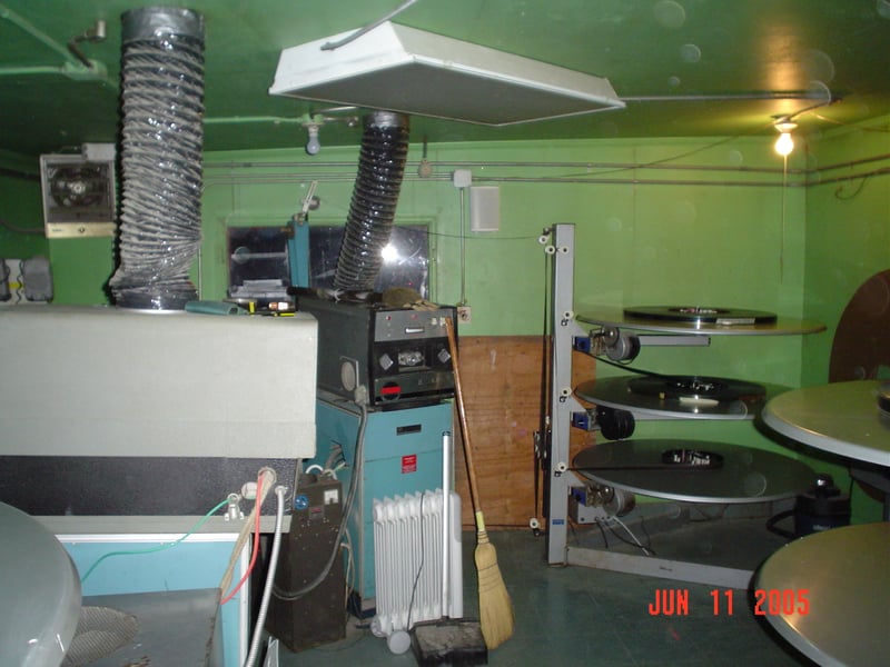 Here's the projection booth from the inside. Projection for screens 1, 2, and 3 are shown, right to left, in this photo. It was pretty tight quarters in there. The projectionist's office had to be removed to add projection for screen 4.