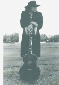 Promo shot from my 3rd album, taken at the Boulevard Drive-In, KC, 1993.