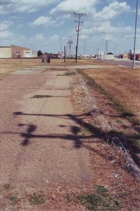 Part of entrance road running parallel to Hwy. 56