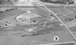 Aerial view taken to show new road construction. Taken from the East. (Cropped version)