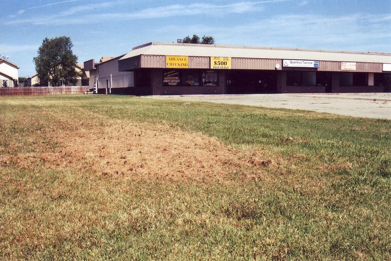 A small strip mall, obviously closed, occupies the former screen tower area