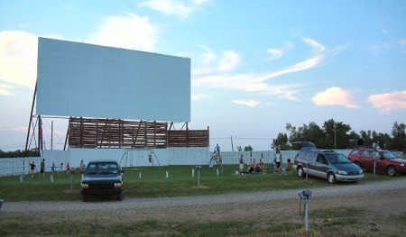 Cars backed in around the screen and the active playground.