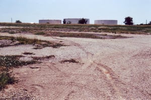 Picture of lot behind ticket booth without speaker poles