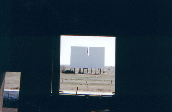 looking out at screen from the projection booth: courtesy of Movie House History - The Classic Theaters of Kansas