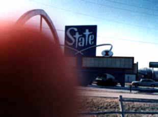 State marquee shot, as taken by Rick Hasley.  By the time Rick noticed the thumb in the way and could return to re-take the shot, the marquee had been removed.