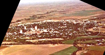 Aerial photo with theater in circle at right. looking south east.