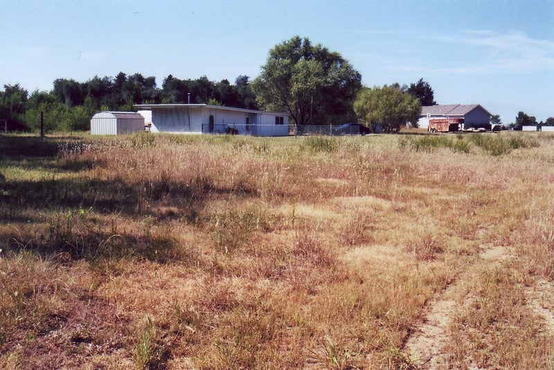 Part of the field with the concession building now used as a private home