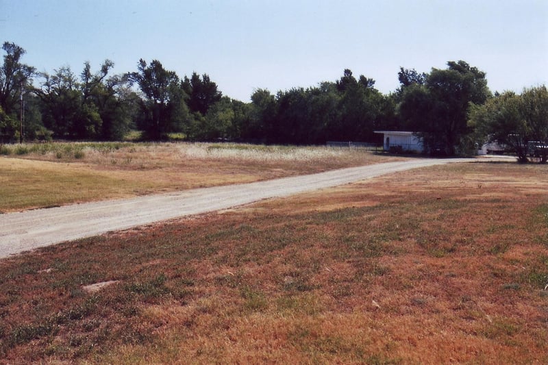 View in the direction where the screen once stood. The exact spot is obscured by trees