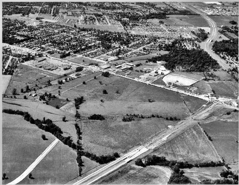 Shelbyville Road in Louisville with Shelbyville Road Plaza to the lower left and East Drive-in to the upper right. 4 lane Watterson Expressway is under construction.Mall St. Matthews will be built across from the drive-in.