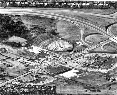 Shelbyville Road in Louisville with the East Drive-in. Most likely taken in the last year or two of the theaters operation. Note the overgrowth in the back rows. 4 lane Watterson Expressway is complete, Mall St. Matthews is now across from the drive-in.