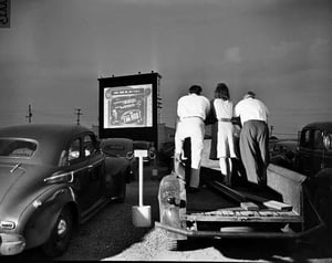 Folks standing in the back of a truck at the East Drive-in.