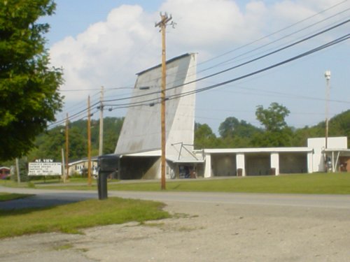 Photo of the sign and screen one taken from across the street. The 3-bay carwash can be seen in this photo.