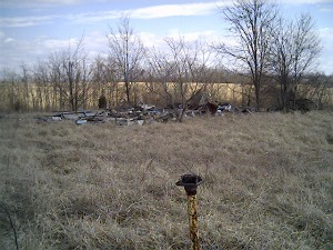 speaker poles and ruins of concession stand from front of field
