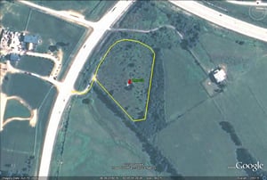 Google Earth image with outline of site