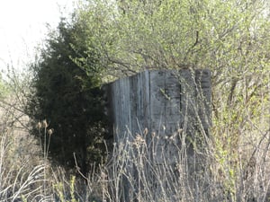 part of a big wall at the back of the field-maybe to screen the field from the highways