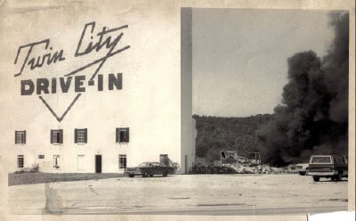 Tearing down the Twin City Drive-In in Horse Cave, Kentucky. That's the concession stand burning down in the background. Now a foam food container factory is in its place.
