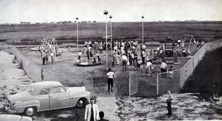 "The playground is equipped with various pieces of motorized and standard rides, and other amusements. It is fenced off and an attendant is always on duty to maintain order."