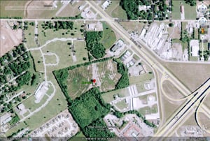 Google Earth image of former site located off N Bolton Ave just N of US-71, south of Enterprise Rd
