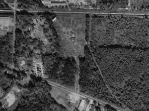 Located along Gause Blvd., not far from the mall. The property has been used for an auto auction since the theatre's closure in the late '70s/early '80s. Part of the marquee still stands and, in this aerial shot, you can see at leat one screen standing in