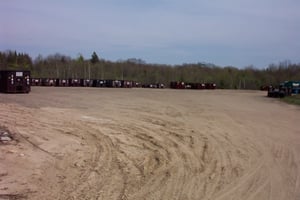 former lot, now occupied by dumpster roll-offs.