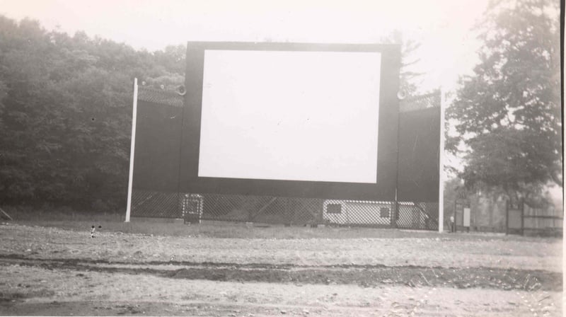 Finished screen. Note the small admission booth behind and to the left. The following year the booth and theater entrance was moved to the rear of the theater. Note also the speakers on each side of the screen.