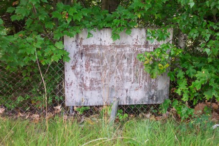 Old, faded exit sign.