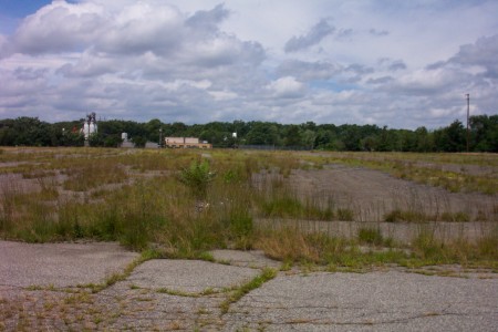 Side view of rear of lot.  You can just barely make out the car ramps.  This used to be a completely paved lot.