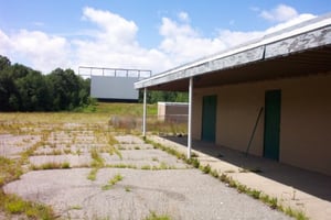 Left side view of snack bar with projection booth and screen in the background.