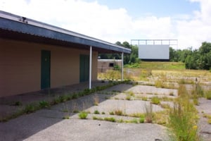 Right side view of snack bar with projection booth and screen in the background.