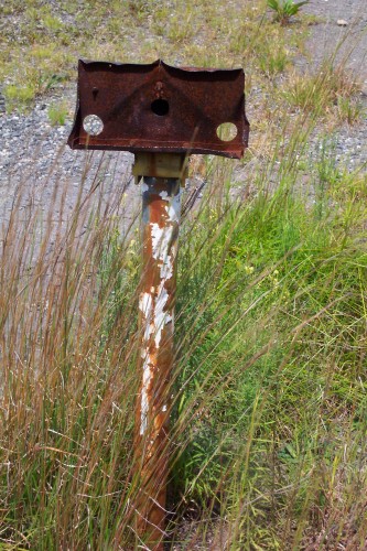 Old light fixture pole on the right side of the snack bar.