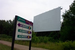 sign with Screen 1 in background.