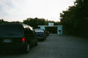 ticket booth entrance with cars