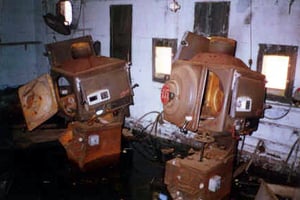 The remains of two projectors that once showed great films like Gone With the Wind, Ben Hur, To Sir With Love;  projection booth