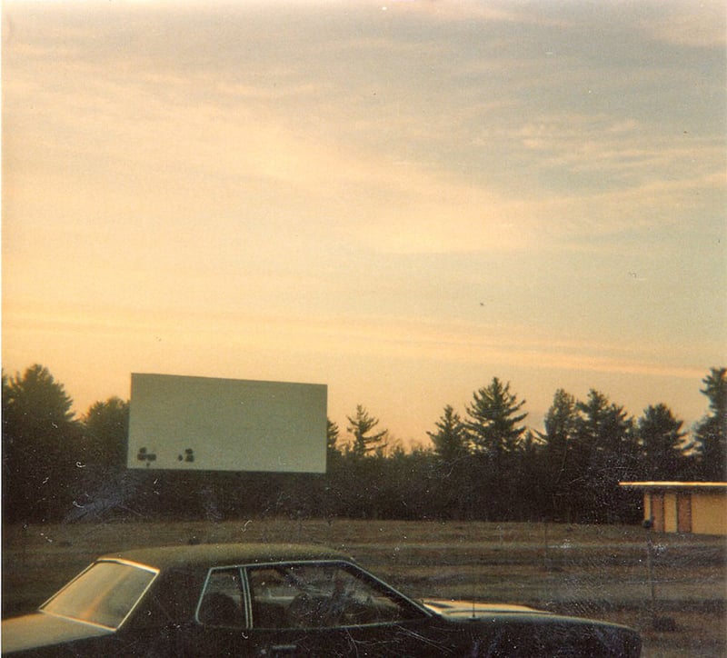 The old screen and a portion of the concession stand, after the drive-in had closed. It looks as though someone had used the screen for target practice.