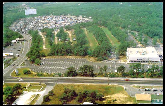 Postcard from the 1990's(?) likely depicting a flea market at the theater.