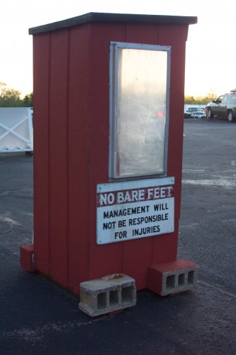 attendants booth. This where your tickets are torn in half and vehicles are directed to the proper color post according to size.